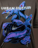 Multi-headed snake graphic in blue and purple on brown t-shirt