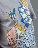 Raised graffiti design and skull illustration on 280 GSM grey t-shirt